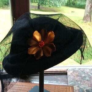 Lovely rolled rim hat with beautiful amber pin and netting